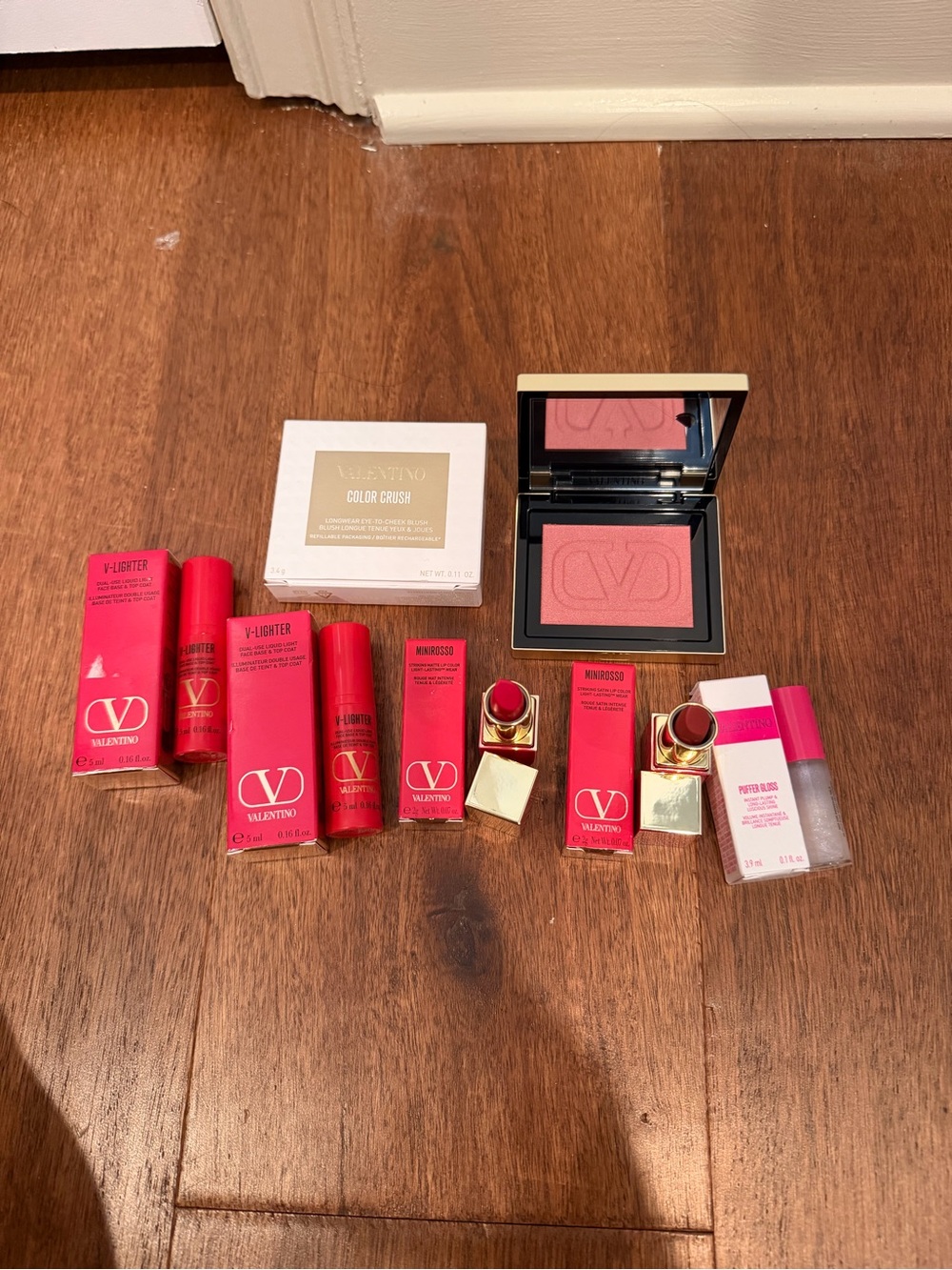 Valentino Pink Blush, puffer gloss, two Valentino lipsticks, two v lighters